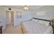 Bright bedroom with a closet, decorated with ocean themed comforter, and a decorative headboard at 1809 Haverford Ave, Sun City Center, FL 33573