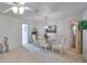 Cozy dining area with a glass table and chair set, lit by an elegant chandelier at 1809 Haverford Ave, Sun City Center, FL 33573