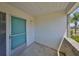 Inviting front porch with screen door entrance and brick wall accents at 1809 Haverford Ave, Sun City Center, FL 33573