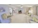 Inviting living room featuring cozy seating and bright natural light at 1809 Haverford Ave, Sun City Center, FL 33573