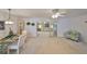 Elegant dining area flowing into a comfortable living area with ample natural light at 1809 Haverford Ave, Sun City Center, FL 33573