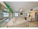 Large main bedroom with mirrored shelving, ceiling fan and neutral carpet at 1809 Haverford Ave, Sun City Center, FL 33573