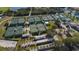 Aerial view of community tennis courts with well-maintained green playing surfaces at 1809 Haverford Ave, Sun City Center, FL 33573