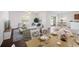 Elegant dining area open to living room, featuring hardwood floors and abundant natural light at 2122 Richwood Pike Dr, Ruskin, FL 33570