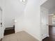 Bright entryway features tile flooring, stairs to the second floor, and a doorway to another room at 2122 Richwood Pike Dr, Ruskin, FL 33570