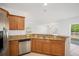 Well-equipped kitchen with stainless steel appliances, granite countertops, and a breakfast bar at 2122 Richwood Pike Dr, Ruskin, FL 33570