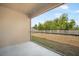 Screened lanai with a view of the backyard and a white picket fence at 2122 Richwood Pike Dr, Ruskin, FL 33570