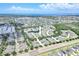 Aerial view of a lakeside community showcasing lush green landscaping, and access to coastal waters at 215 Oceania Ct, Apollo Beach, FL 33572
