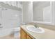 Bathroom with a tub-shower combination and a vanity with a sink, offering essential amenities and cleanliness at 215 Oceania Ct, Apollo Beach, FL 33572