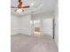 Bedroom with ceiling fan and ensuite bathroom access for added privacy and convenience at 215 Oceania Ct, Apollo Beach, FL 33572