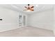Bedroom with ceiling fan and access to the pool area through French doors at 215 Oceania Ct, Apollo Beach, FL 33572
