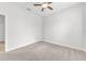 Spacious bedroom with neutral carpet, a ceiling fan, and ample natural light creating a serene atmosphere at 215 Oceania Ct, Apollo Beach, FL 33572