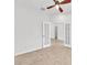 Bright room with tile floors, neutral walls, and double doors, offering flexible space at 215 Oceania Ct, Apollo Beach, FL 33572