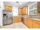 Kitchen with stainless steel appliances and light wooden cabinets at 215 Oceania Ct, Apollo Beach, FL 33572