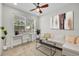 Bright office space with neutral paint and a modern ceiling fan, perfect for working from home at 215 Oceania Ct, Apollo Beach, FL 33572