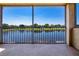 Balcony view of the lake and tree line at 2246 Sifield Greens Way # 36, Sun City Center, FL 33573
