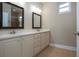 Bathroom includes double sink vanity, tile floor and walk-in shower at 2246 Sifield Greens Way # 36, Sun City Center, FL 33573