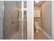 Bathroom featuring a tiled shower, toilet, tiled flooring, and built in storage at 2246 Sifield Greens Way # 36, Sun City Center, FL 33573