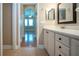 View from bathroom into bedroom, which features plantation shutters and hardwood floors at 2246 Sifield Greens Way # 36, Sun City Center, FL 33573