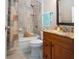 Bathroom featuring a granite countertop, decorative shower curtain and a blue towel at 2246 Sifield Greens Way # 36, Sun City Center, FL 33573