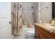 Bathroom featuring a tub with decorative shower curtain, and granite counters at 2246 Sifield Greens Way # 36, Sun City Center, FL 33573