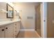 Bathroom featuring tile flooring, frameless shower, single vanity, and neutral walls at 2246 Sifield Greens Way # 36, Sun City Center, FL 33573