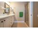 Updated bathroom featuring tile flooring, frameless shower, single vanity, and neutral walls at 2246 Sifield Greens Way # 36, Sun City Center, FL 33573