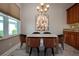 This dining area is furnished with a modern table and seating for six guests at 2246 Sifield Greens Way # 36, Sun City Center, FL 33573