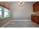 Bright dining area features neutral paint, tile flooring, and a window for natural light at 2246 Sifield Greens Way # 36, Sun City Center, FL 33573