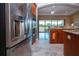 This gourmet kitchen features stainless appliances including refrigerator and double ovens at 2246 Sifield Greens Way # 36, Sun City Center, FL 33573