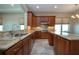 The eat-in kitchen includes granite countertops, custom cabinets, and stainless steel appliances at 2246 Sifield Greens Way # 36, Sun City Center, FL 33573