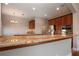 Gourmet kitchen boasts granite countertops, stainless steel appliances, and ample cabinet space at 2246 Sifield Greens Way # 36, Sun City Center, FL 33573