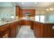 A modern eat-in kitchen is equipped with granite countertops and stainless steel appliances at 2246 Sifield Greens Way # 36, Sun City Center, FL 33573