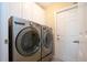Modern laundry room featuring a front-load LG washer and dryer set, providing convenience and efficiency at 2246 Sifield Greens Way # 36, Sun City Center, FL 33573