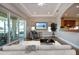 Inviting living room with light wood floors and sliding glass doors to outdoor living space at 2246 Sifield Greens Way # 36, Sun City Center, FL 33573