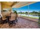 Relax on the screened patio with picturesque water views, complete with outdoor seating and a tranquil ambiance at 2246 Sifield Greens Way # 36, Sun City Center, FL 33573