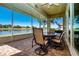 Enjoy picturesque water views from the screened patio with brick flooring and comfortable outdoor seating at 2246 Sifield Greens Way # 36, Sun City Center, FL 33573