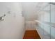 Organized walk-in closet featuring wire shelving and hardwood flooring at 2246 Sifield Greens Way # 36, Sun City Center, FL 33573