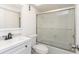 This full bathroom offers a white vanity sink, black hardware and a shower-tub combo at 2650 Countryside Blvd # A104, Clearwater, FL 33761