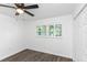The bedroom features a ceiling fan, wood-look floors, and a double-door closet at 2650 Countryside Blvd # A104, Clearwater, FL 33761