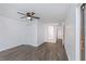 Bright bedroom featuring modern flooring and a ceiling fan with a hallway view at 2650 Countryside Blvd # A104, Clearwater, FL 33761