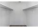 Walk-in closet with two rods for hanging clothes at 2650 Countryside Blvd # A104, Clearwater, FL 33761