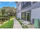 The exterior shows a walkway leading to the unit, located near a pond at 2650 Countryside Blvd # A104, Clearwater, FL 33761
