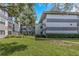 Beautiful condo building with multiple units and lush green lawn and landscaping at 2650 Countryside Blvd # A104, Clearwater, FL 33761