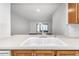 Close-up of the kitchen sink overlooking the open-plan living area at 2650 Countryside Blvd # A104, Clearwater, FL 33761