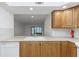 Kitchen sink featuring wood cabinets at 2650 Countryside Blvd # A104, Clearwater, FL 33761