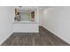 The open-plan living area has wood-look floors that lead into the kitchen at 2650 Countryside Blvd # A104, Clearwater, FL 33761