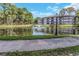 Enjoy the tranquil pond with a fountain and lush greenery at 2650 Countryside Blvd # A104, Clearwater, FL 33761