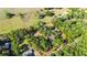 Expansive aerial view of the property showcasing lush landscaping, fencing, and the beautiful surrounding area at 27477 Old Trilby Rd, Brooksville, FL 34602