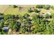 Overhead shot showcasing the property's acreage, boundaries, and mature trees in a serene setting at 27477 Old Trilby Rd, Brooksville, FL 34602